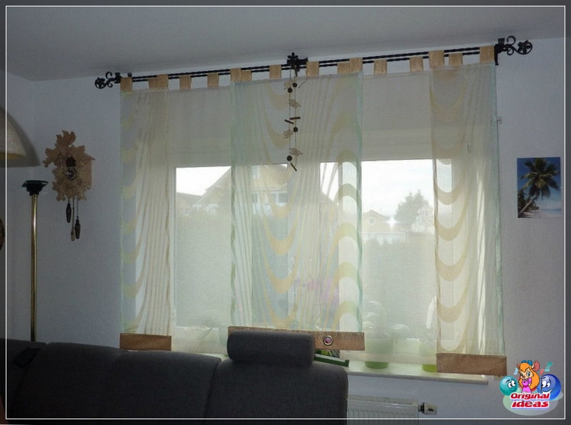 cornisa Las cortinas de aire con ribetes de raso, en la cornisa con una elegante punta forjada enfatizan la sofisticación del interior