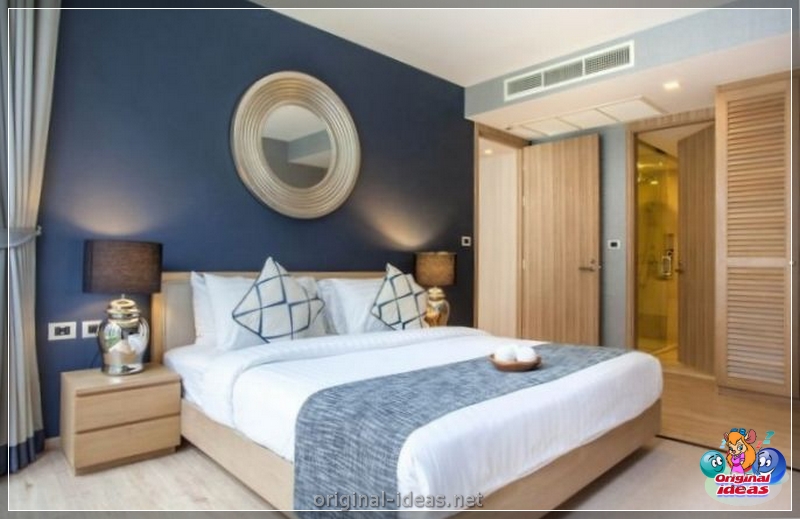 O interior do quarto no estilo escandinavo 2023: novos itens, com papel de parede, em tons cinzentos, com móveis brancos, fotos reais (estilo) O interior do quarto no estilo escandinavo 2023: novos itens, com papel de parede, em tons cinzentos, com móveis brancos, fotos reais