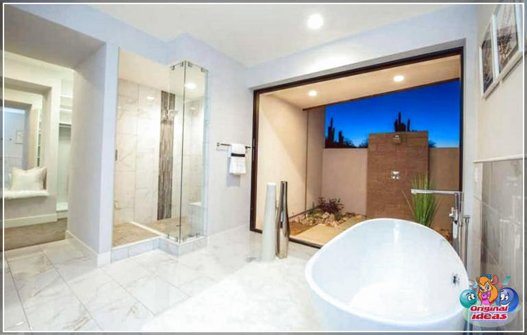 40 idées de design de salle de bain moderne (photos) () Salle de bains principale moderne avec vue sur la fenêtre de carreaux de marbre depuis la baignoire