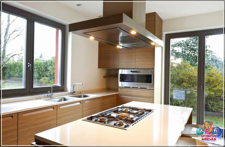 cuisine moderne Cuisine à la maison moderne avec armoires marron et cuisinière dans l'île